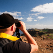 Christoph looking at the stunning landscape of Madeira island with binoculars