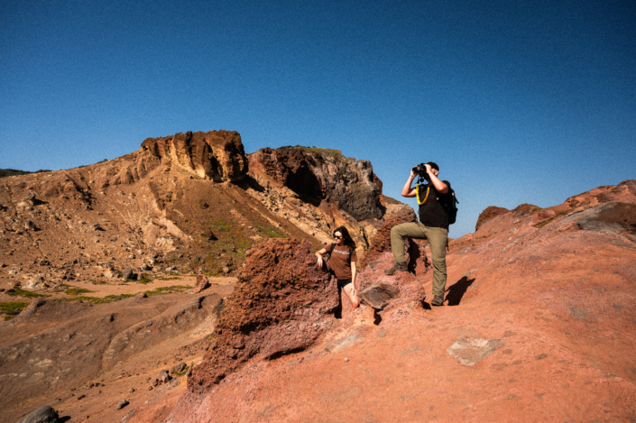 A pair of two exploring a rocky dessert