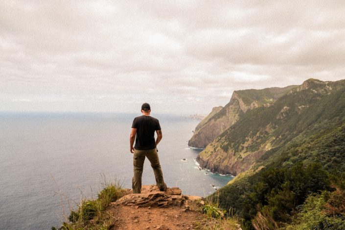 Christoph on a cliff on Madeira island, looking along the North-Eastern shore