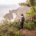 Female Digital Nomad spreading her arms at a stunning ocean view on Madeira island