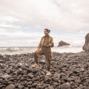 Female Digital Nomad on a pebble beach