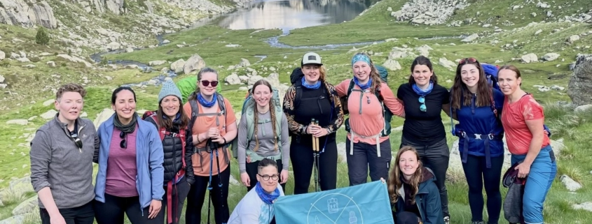 Kate Capelli and her Adventuresses hiking in the mountains